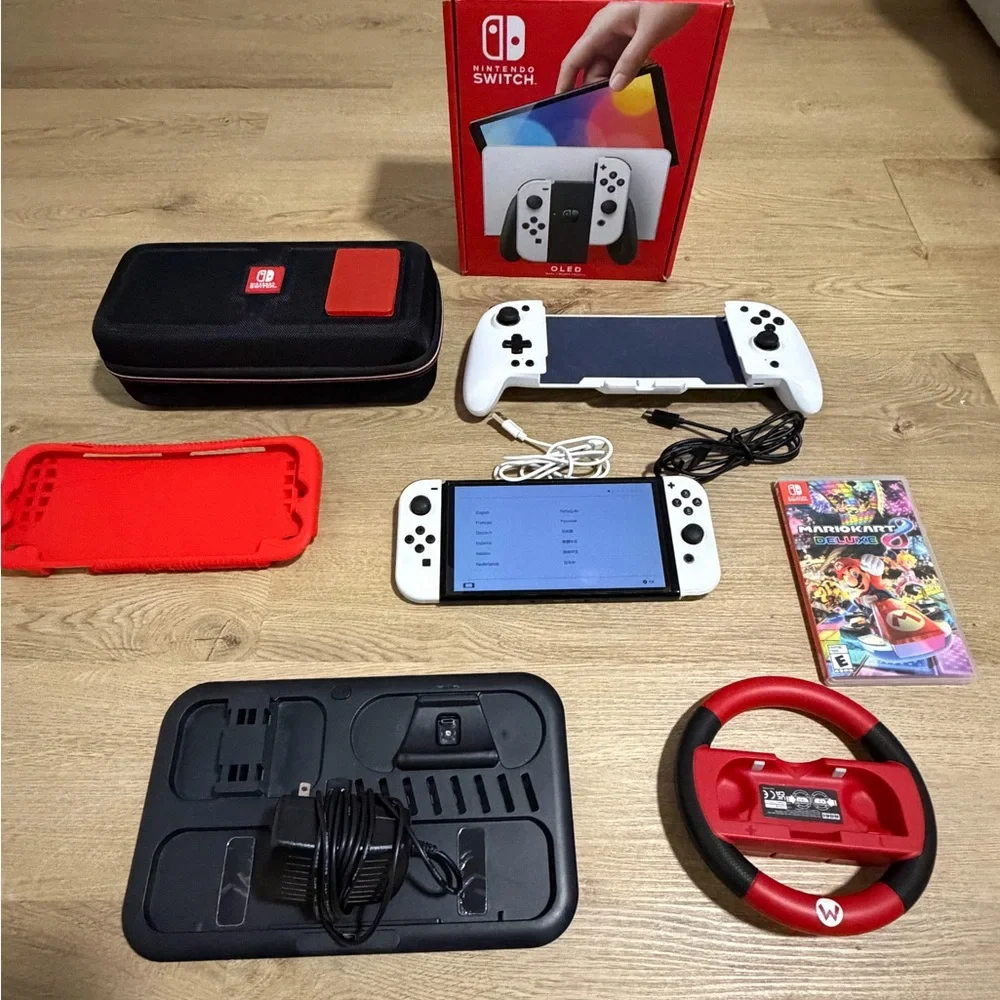 Nintendo Switch OLED (White) bundle. comes with all original parts and cords.